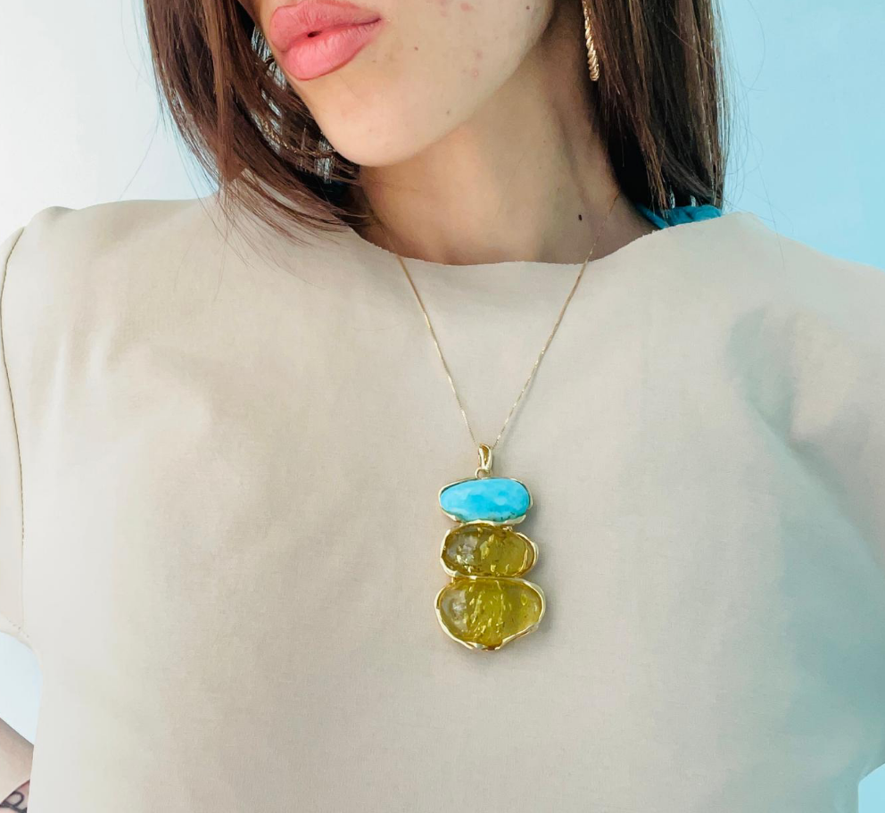 Amber and turquoise tris pendant necklace mounted on silver