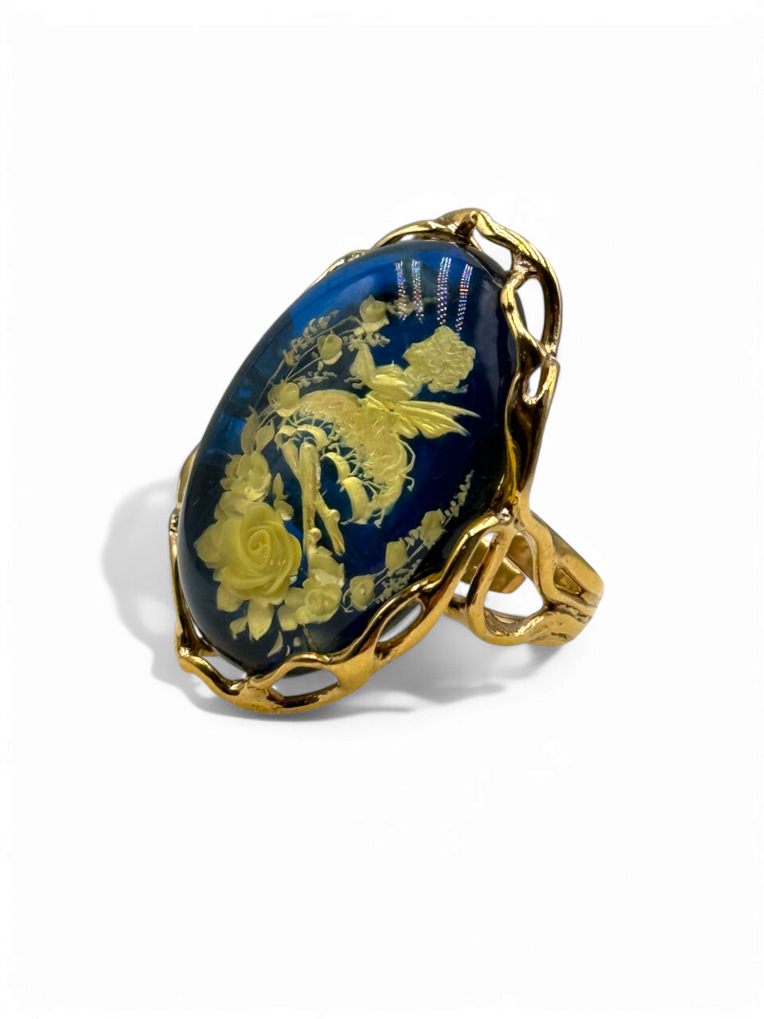 Retro engraved "fairy" ring in blue amber mounted on gold plated silver