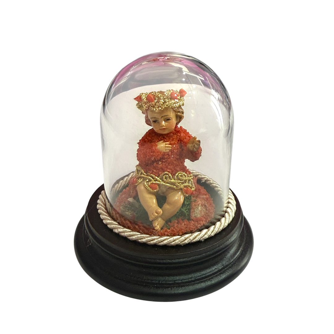 Baby Jesus in a bell, studded with coral