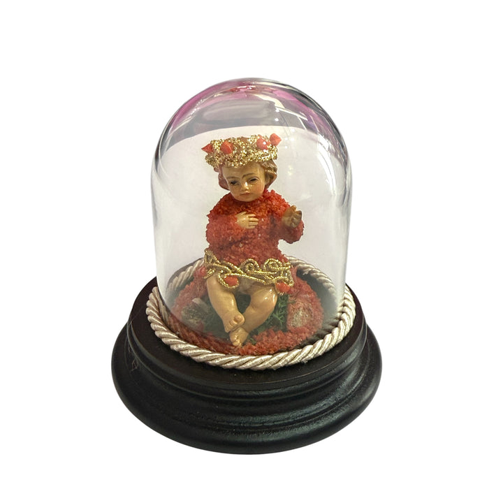 Baby Jesus in a bell, studded with coral