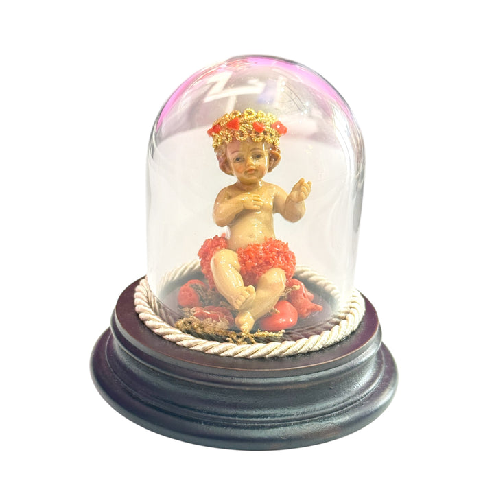 Baby Jesus in a bell, studded with coral