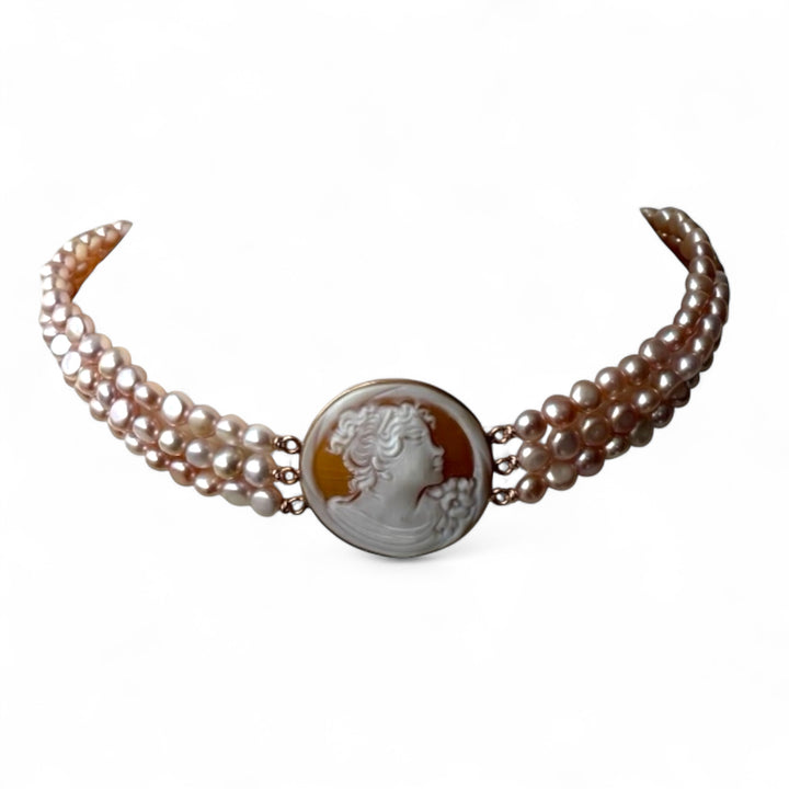 Multi-strand necklace of river pearls with a “sardonic cameo lady” mounted in silver