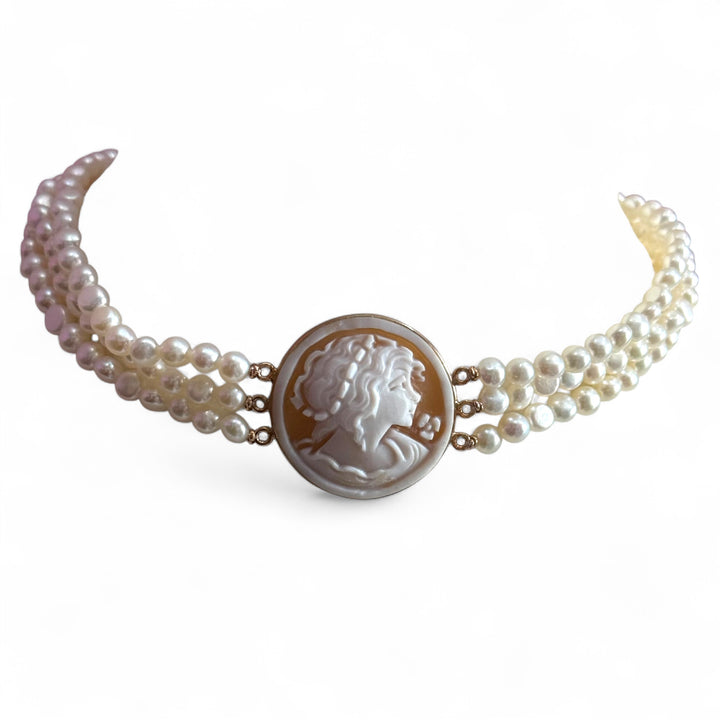 Multi-strand necklace of river pearls with a “sardonic cameo lady” mounted in silver