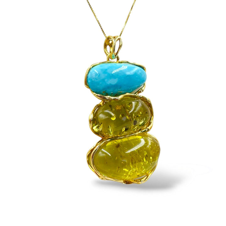 Amber and turquoise tris pendant necklace mounted on silver