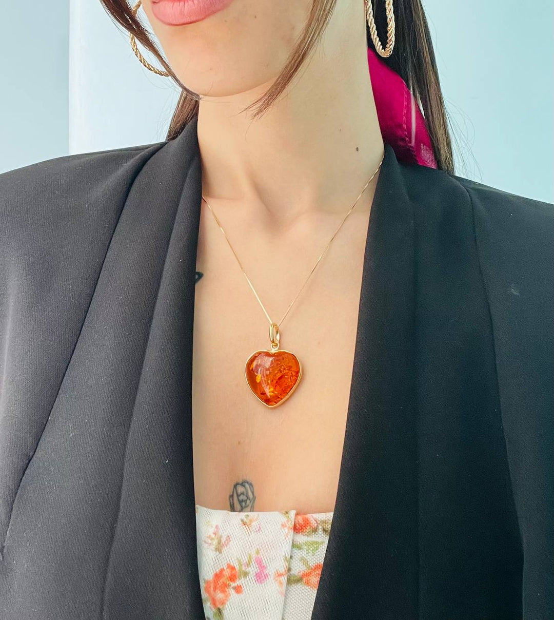 Amber heart pendant necklace mounted on silver