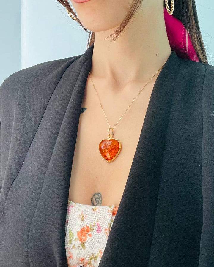 Amber heart pendant necklace mounted on silver