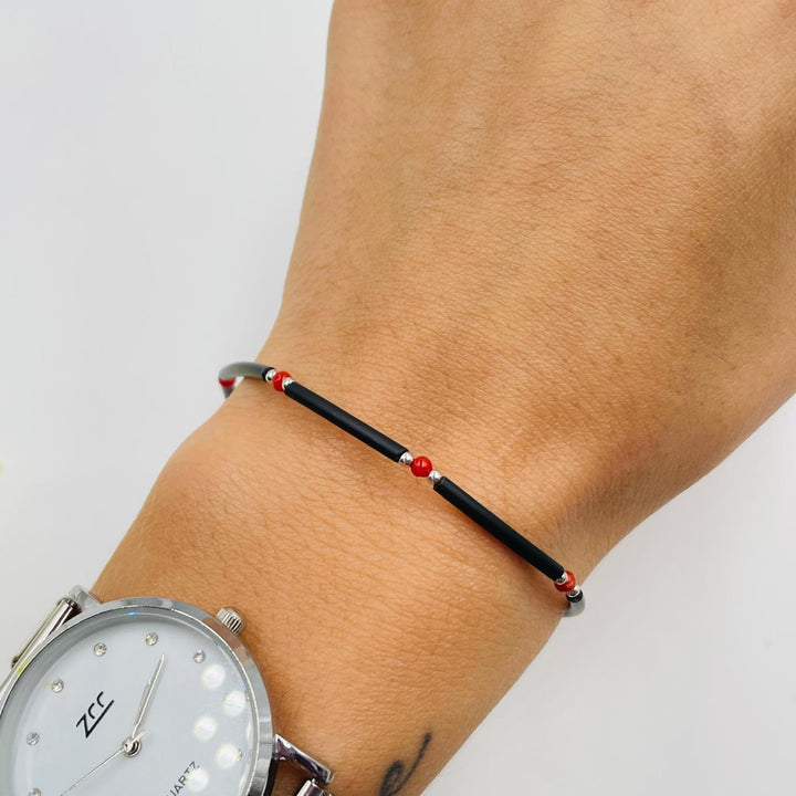 END OF COLLECTION - Coral bead bracelet mounted on rubber