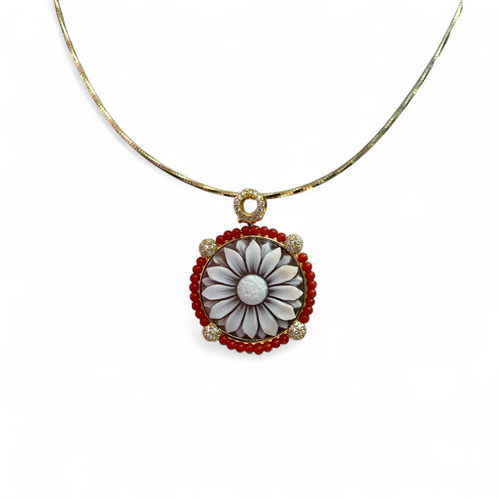 Cameo flower pendant necklace mounted on woven coral and silver