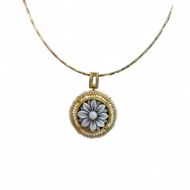 Cameo flower pendant necklace mounted on woven coral and silver