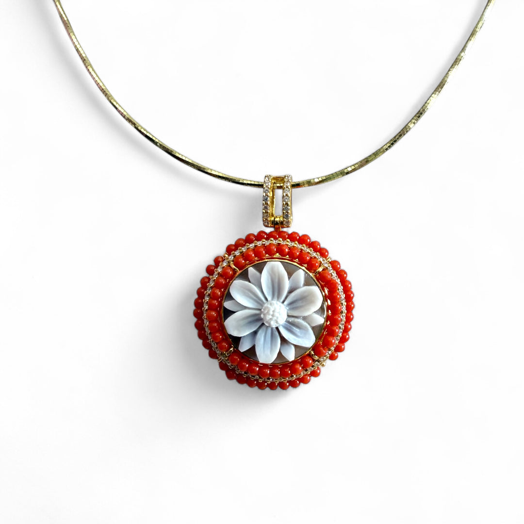 Cameo flower pendant necklace mounted on woven coral and silver