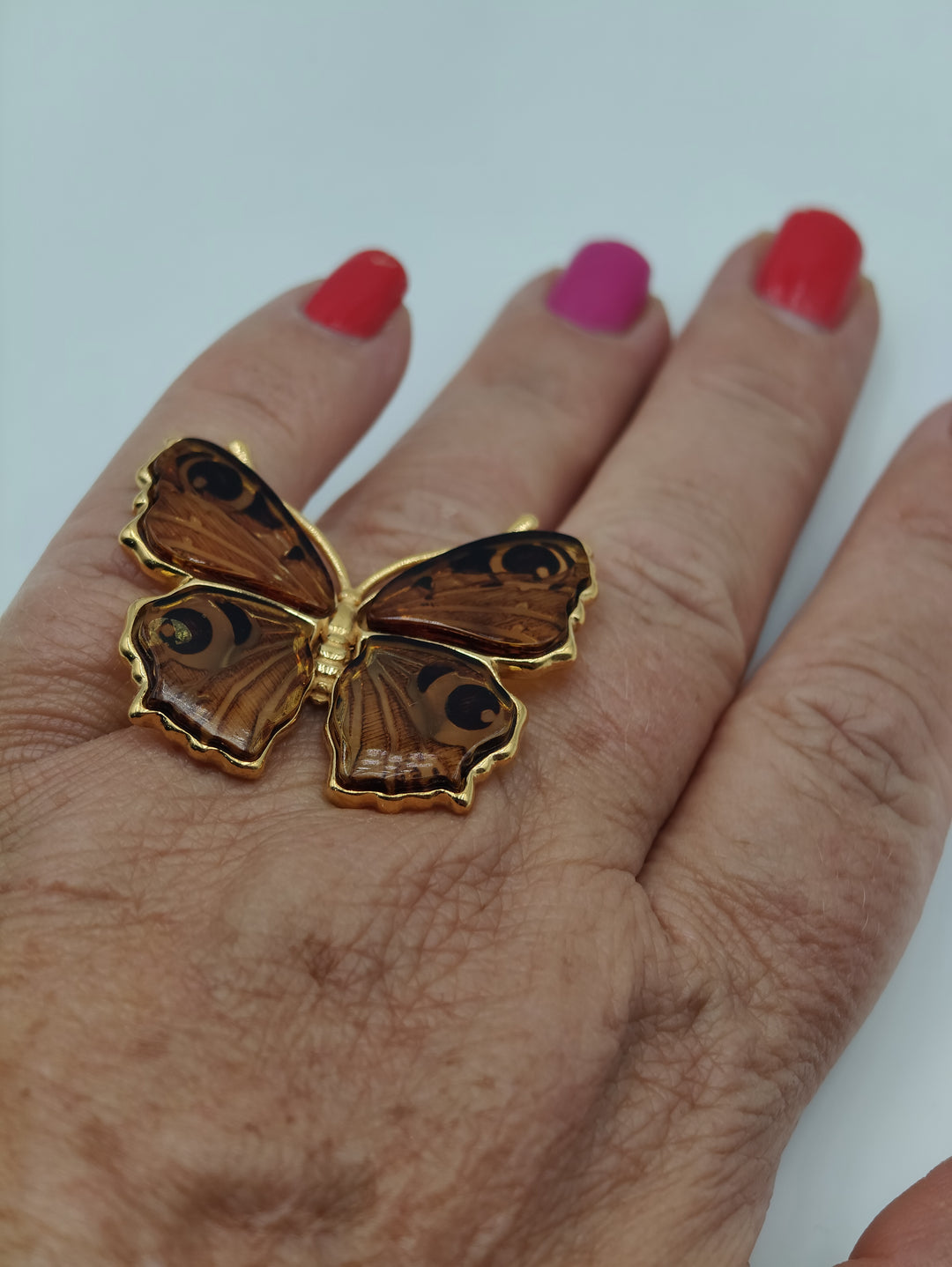 Anello farfalla in ambra montato su argento galvanica oro