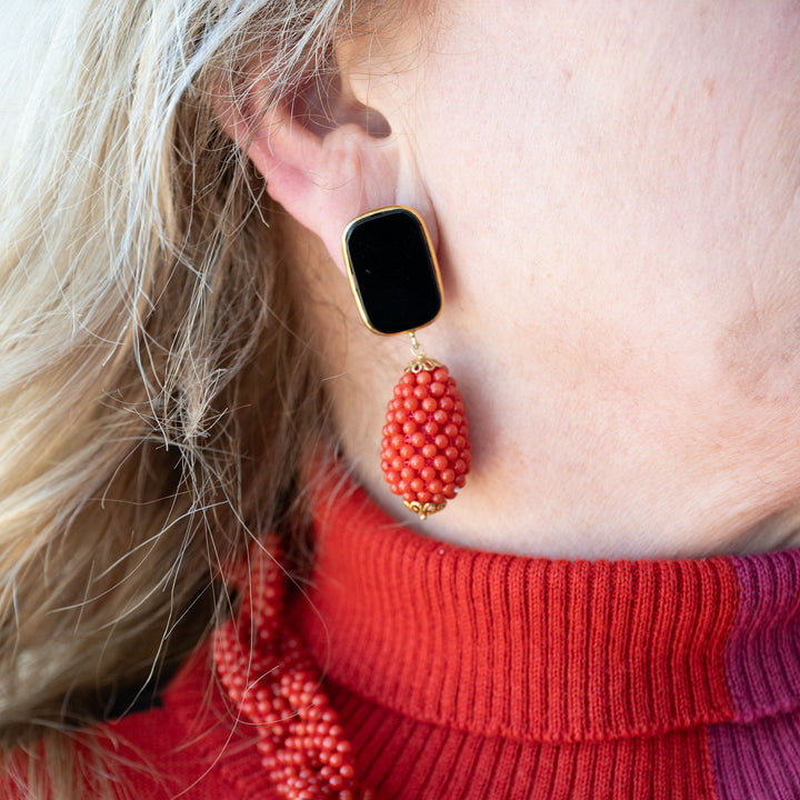 Red coral and black agate pendant earrings mounted on silver