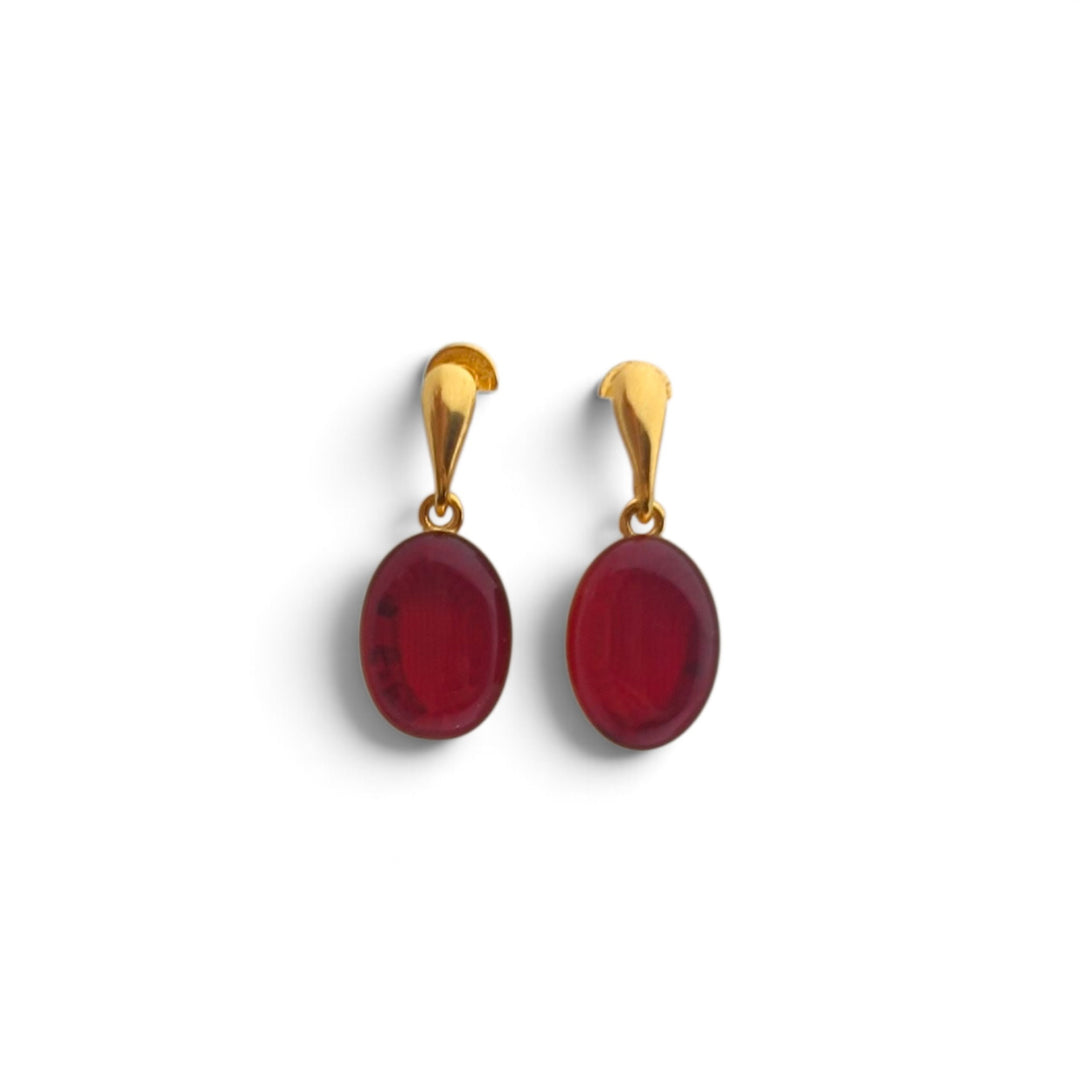 Orecchini Ovali di Ambra rossa montati in Argento Dorato