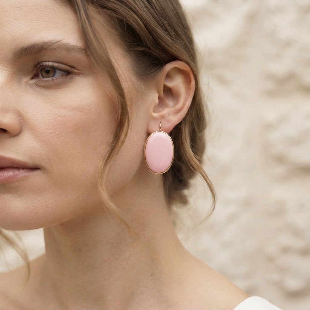 Orecchini Ovali di Pasta di Corallo rosa montati in Argento Dorato