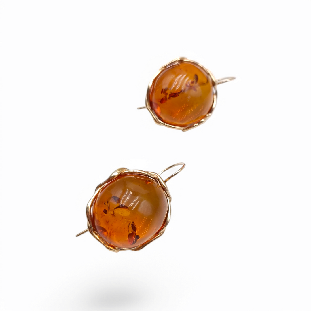 Red amber earrings mounted on gold plated silver