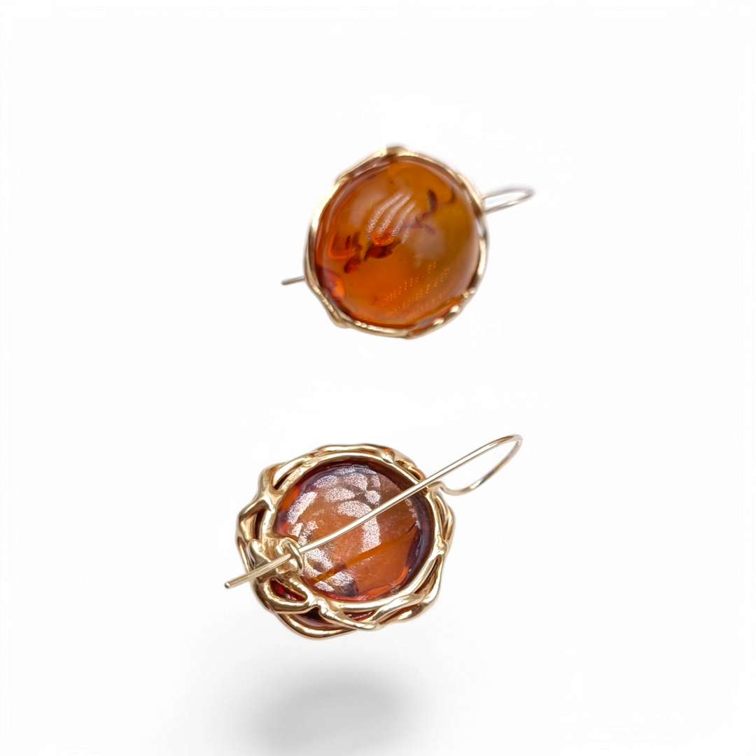 Red amber earrings mounted on gold plated silver