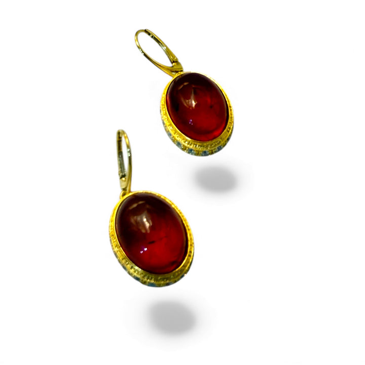 Orecchini ovali di ambra del baltico montati in argento e zirconi