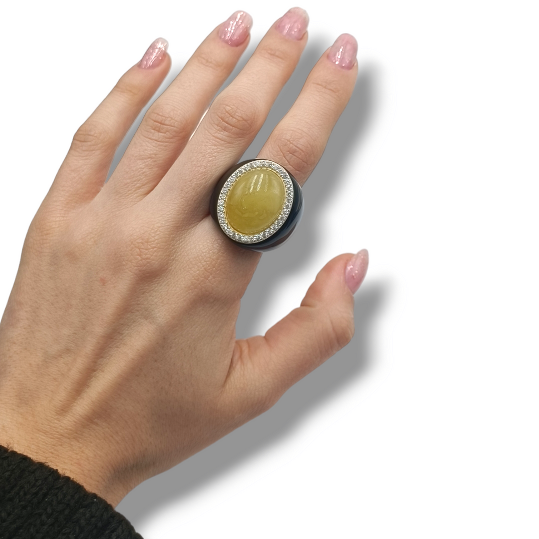 Oval amber ring mounted on silver