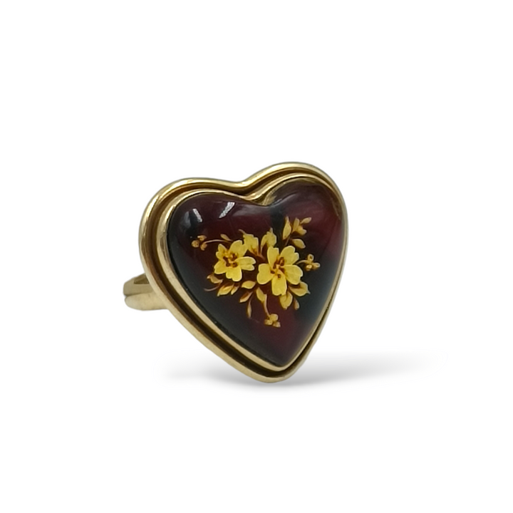 Amber heart ring mounted on silver