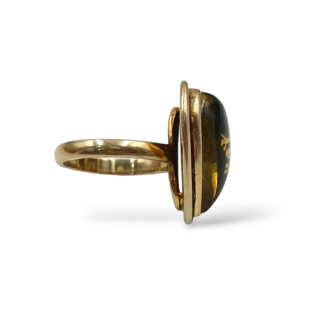 Amber heart ring mounted on silver