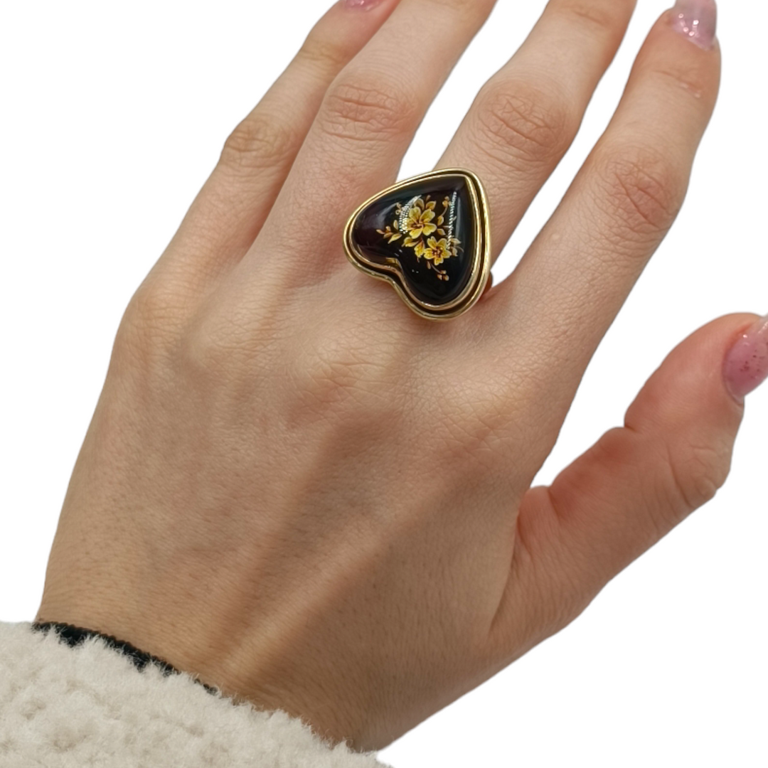 Amber heart ring mounted on silver