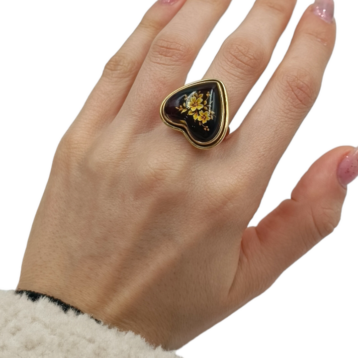 Amber heart ring mounted on silver