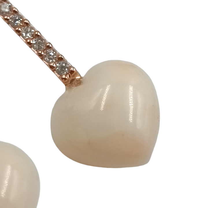 Orecchini cuore in corallo e kunzite montati su argento