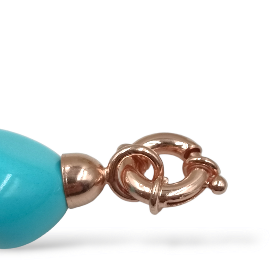 Coral sphere bracelet mounted on turquoise and silver paste