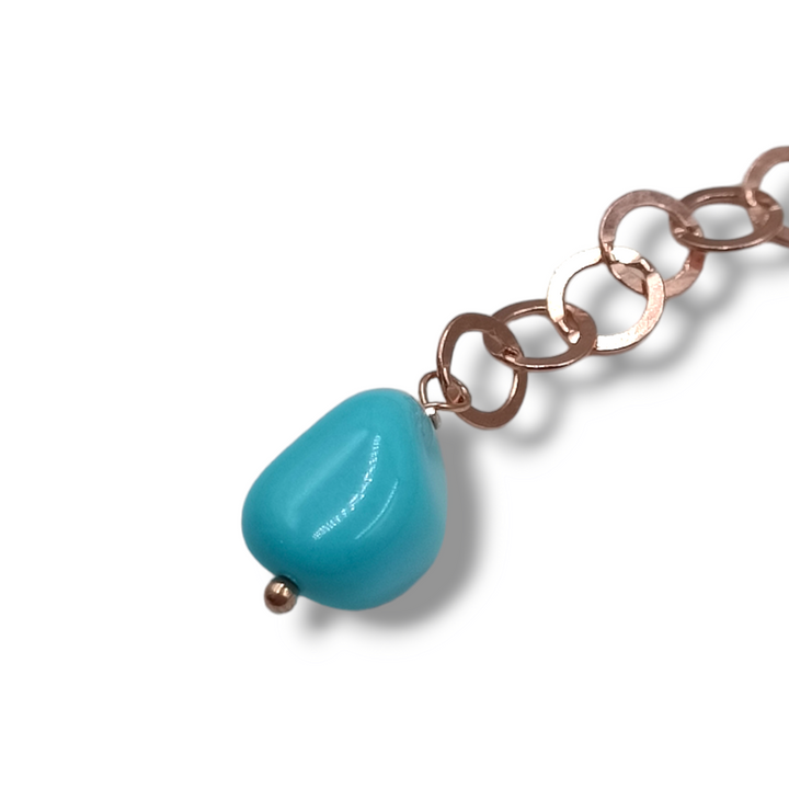 Coral sphere bracelet mounted on turquoise and silver paste