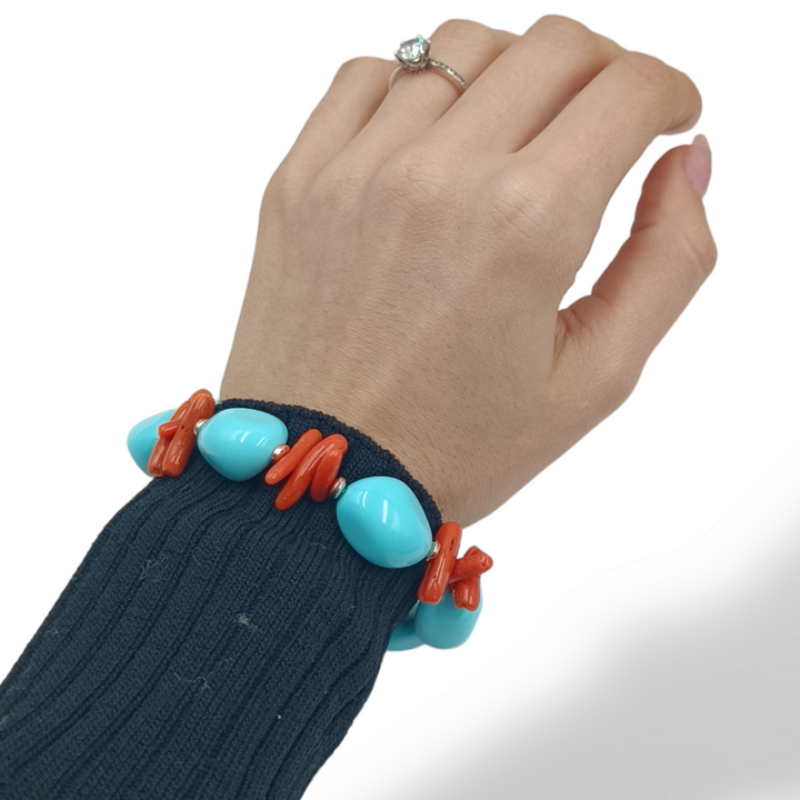 Coral sphere bracelet mounted on turquoise and silver paste