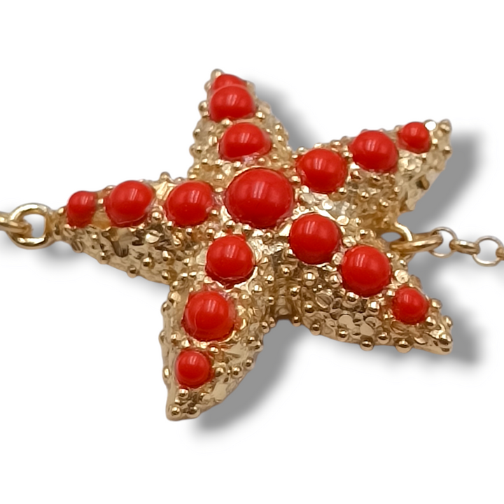 Bracciale stella in corallo montato su argento