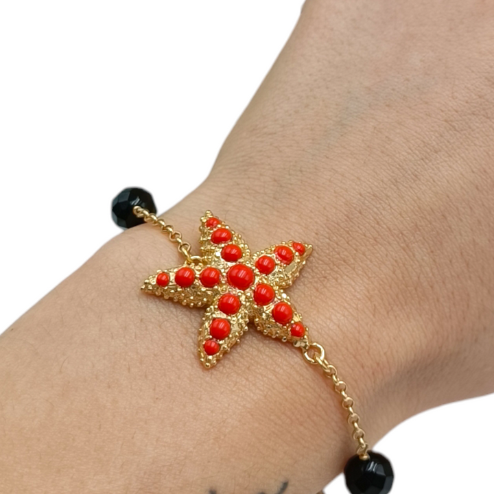 Bracciale stella in corallo montato su argento