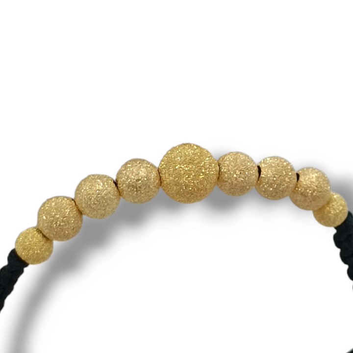 END OF COLLECTION - Bracelet with spheres in gold-plated satin silver mounted on rubber