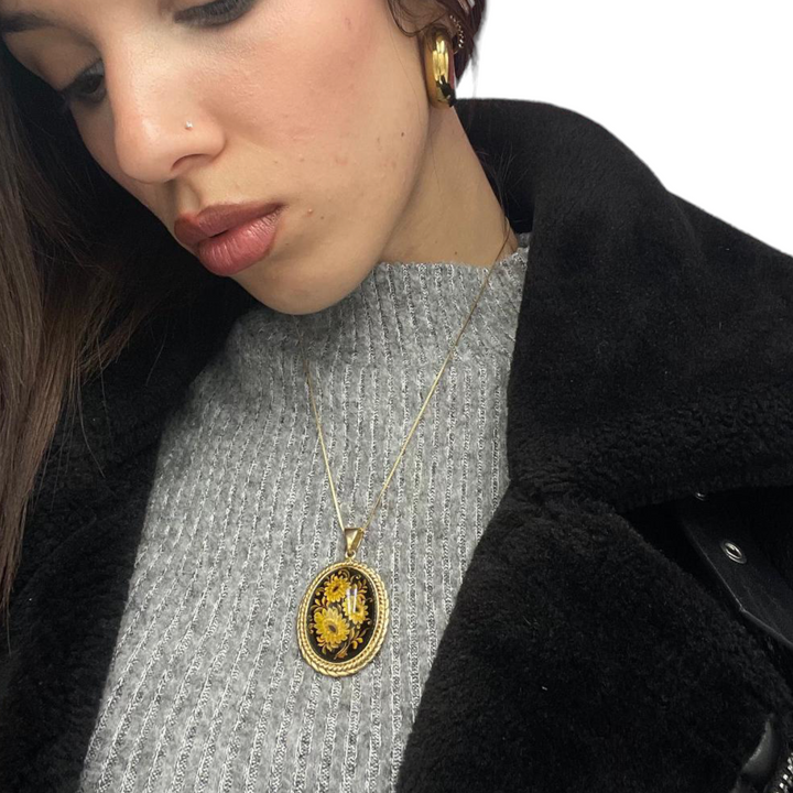 Ciondolo fiori in ambra montato su argento