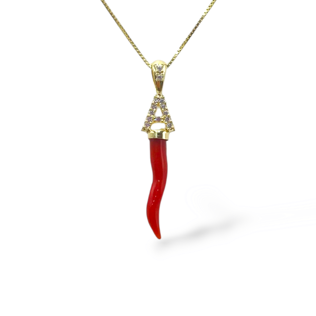 Real coral horn pendant mounted with silver and zirconia letter