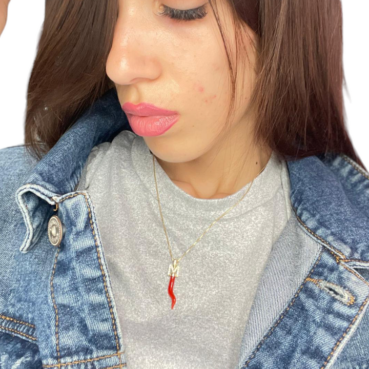 Real coral horn pendant mounted with silver and zirconia letter