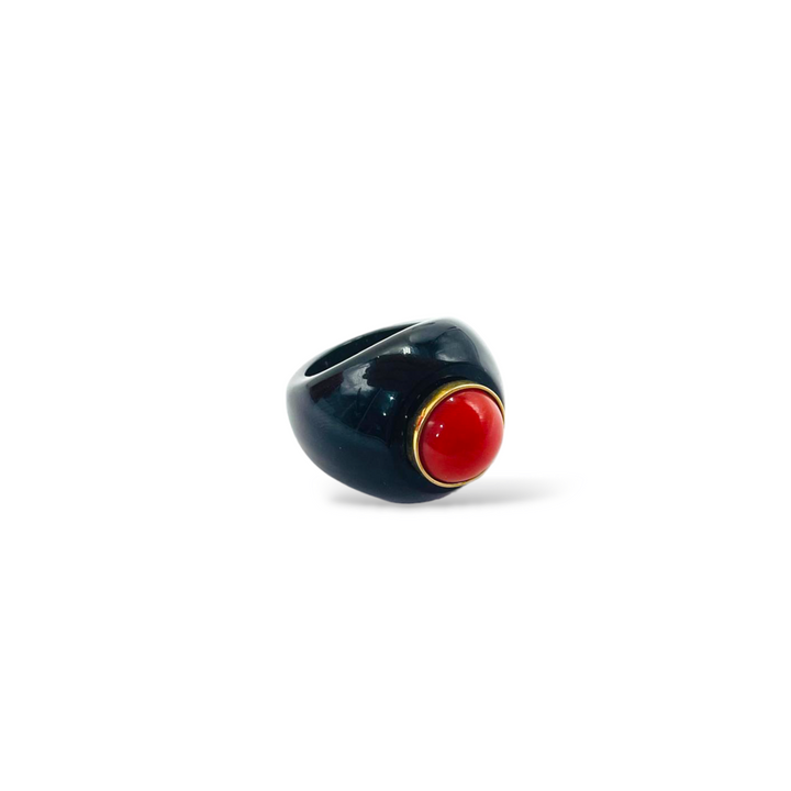 Real red coral ring mounted on black agate 