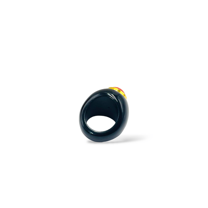 Real red coral ring mounted on black agate 