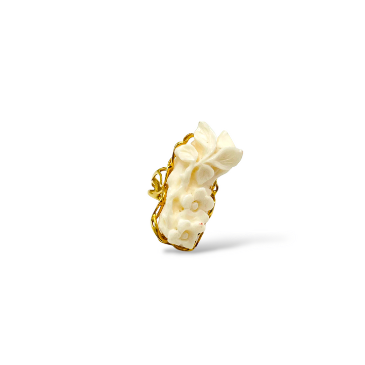 White coral flower ring mounted on silver
