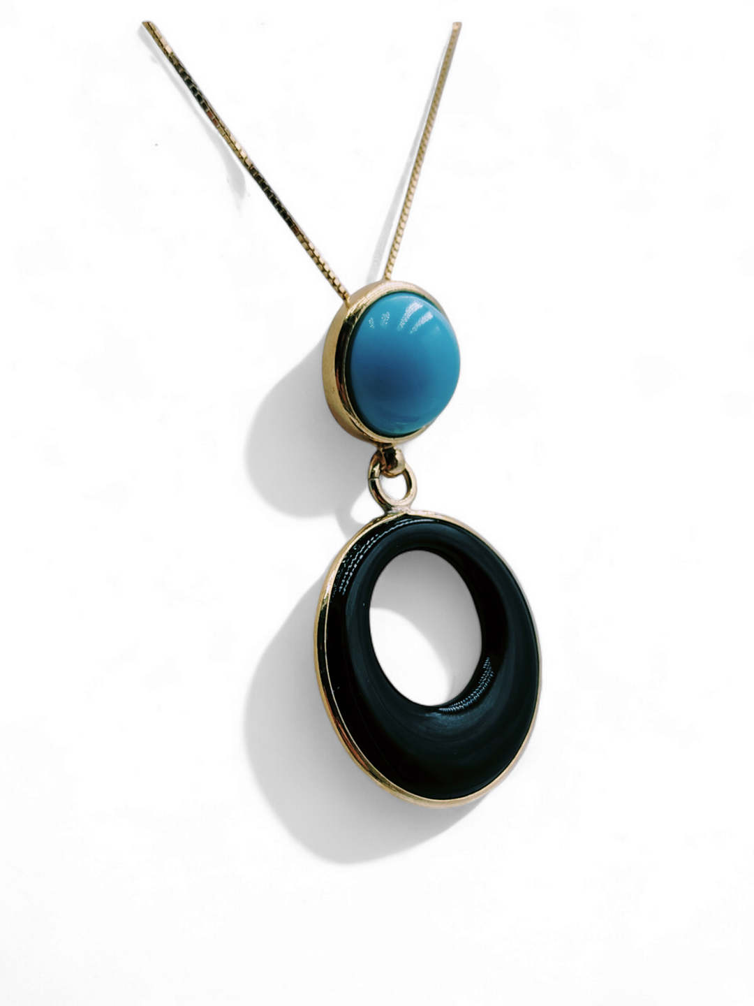 Pendant in turquoise paste and black agate mounted on silver