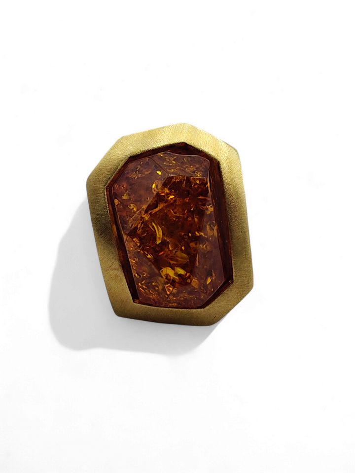 Green and red amber ring mounted on gold plated silver