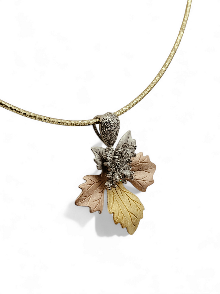 Leaf pendant necklace in silver, gold and copper with zircons