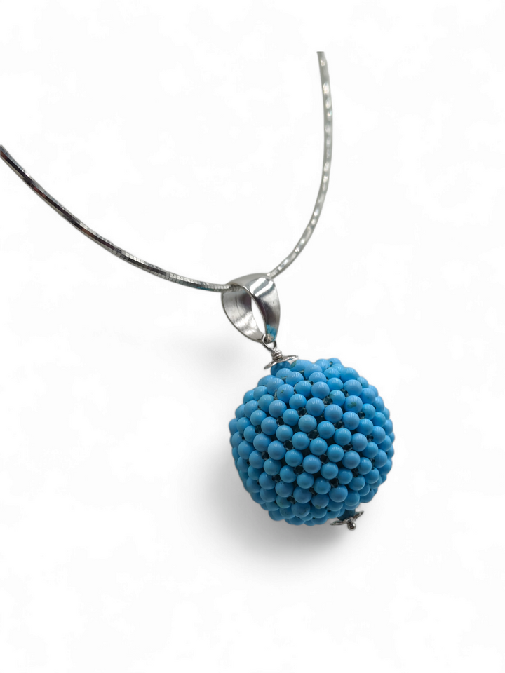 Turquoise paste sphere pendant necklace mounted on silver