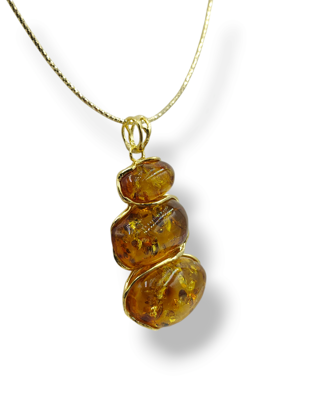 Red amber tris pendant mounted on silver