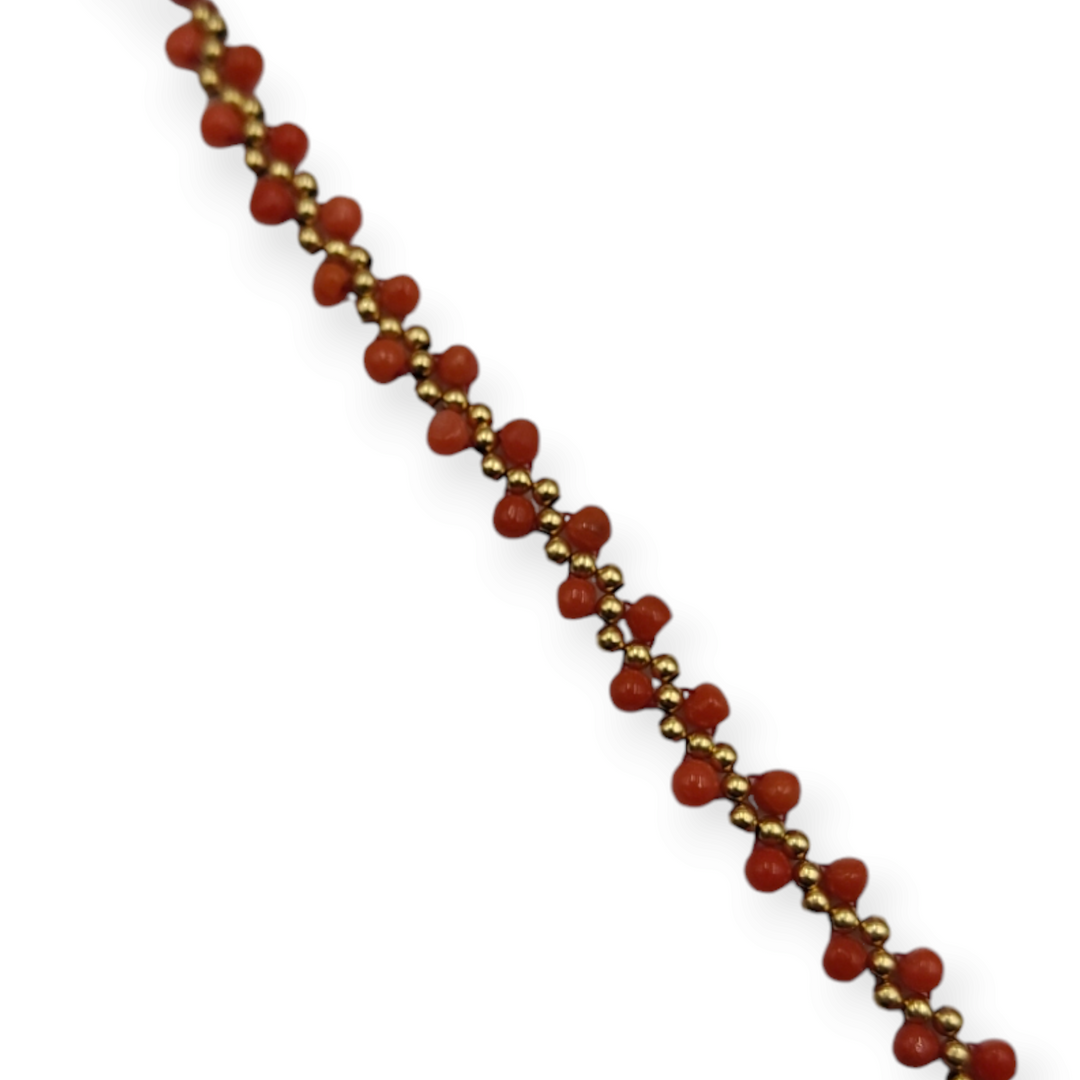 Real coral bracelet in fabric mounted on 18 kt gold