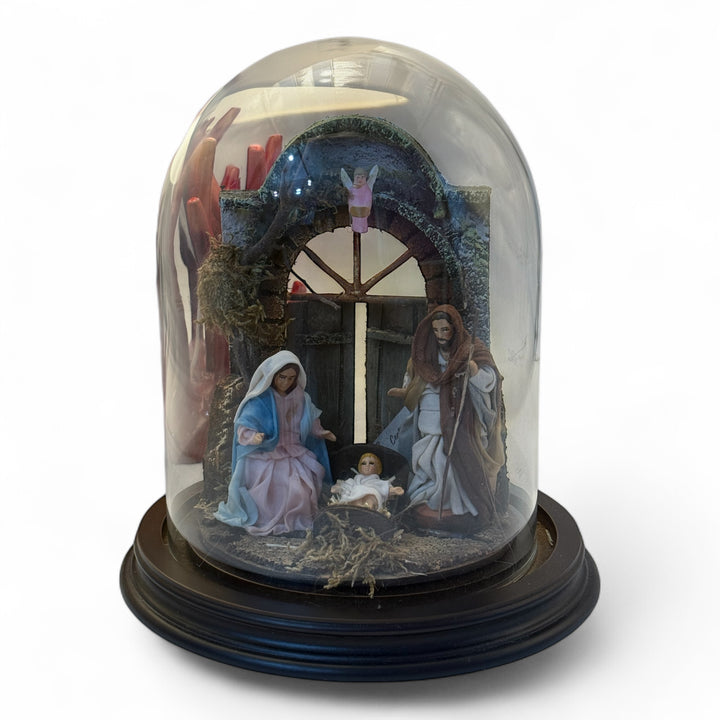 Nativity scene in a bell with terracotta characters and real clothes