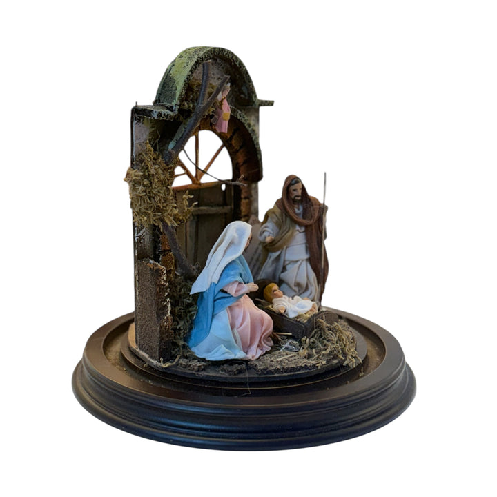 Nativity scene in a bell with terracotta characters and real clothes
