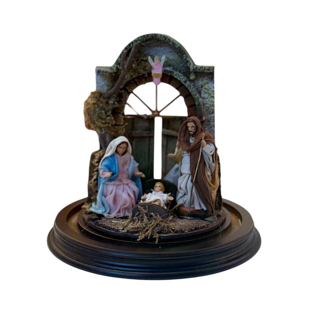 Nativity scene in a bell with terracotta characters and real clothes