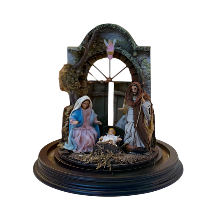 Nativity scene in a bell with terracotta characters and real clothes