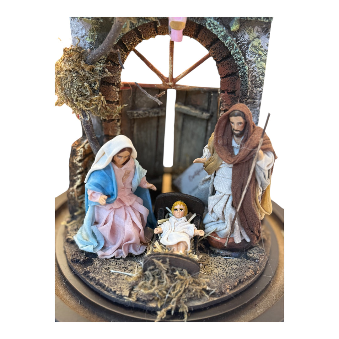Nativity scene in a bell with terracotta characters and real clothes